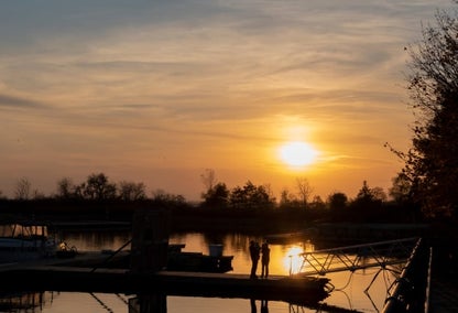 Family at Colonel Samuel Smith Park marina, New Toronto, at sunset